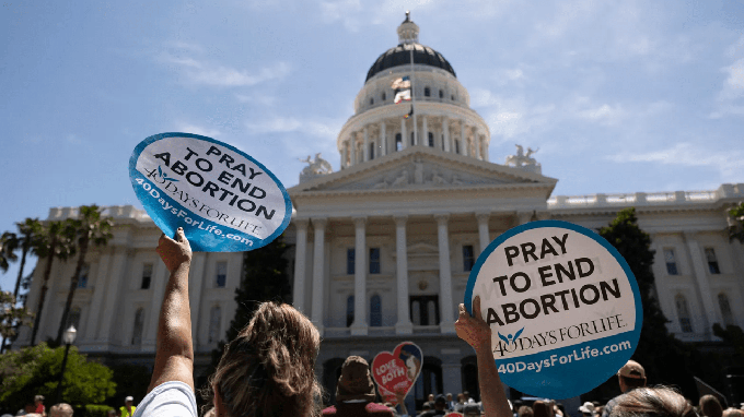 Image caption: Protesters gathered at the California Capitol rally against abortion measures before the Legislature on June 22, 2022.