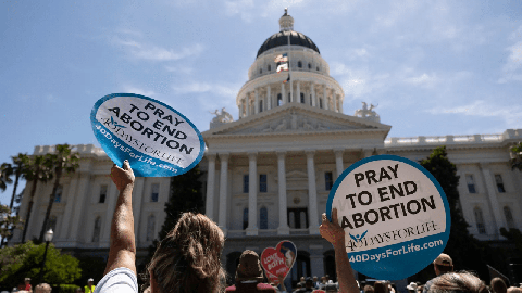 Image caption: Protesters gathered at the California Capitol rally against abortion measures before the Legislature on June 22, 2022.