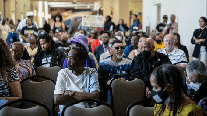 Image caption: Members of the public attend a California Reparations Task Force meeting at the California Science Center in Los Angeles on Sept. 23, 2022.