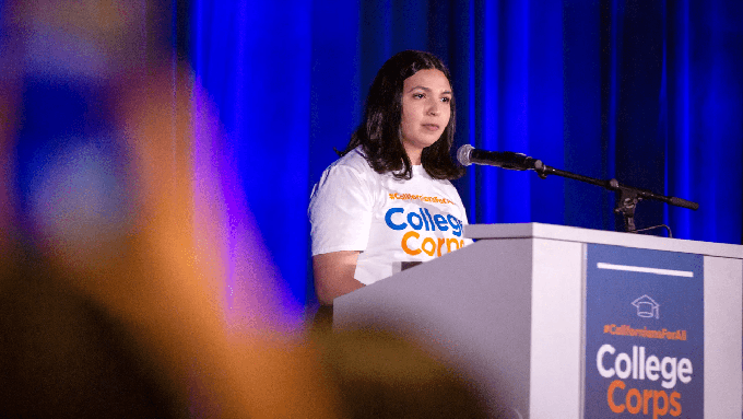 Image caption: Yusbely Delgado Medrano, a UC Davis College Corps fellow, speaks during a swearing-in ceremony for the fellows in Sacramento on Oct. 7, 2022.