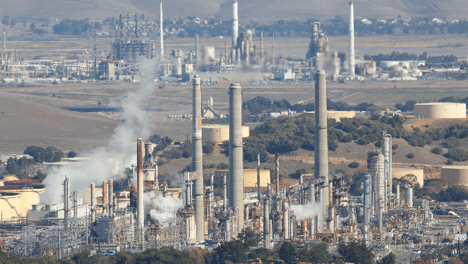 Gases being released at the Marathon oil refinery in Martinez. Under the state's new climate change plan, refineries would capture carbon emissions and inject them underground.