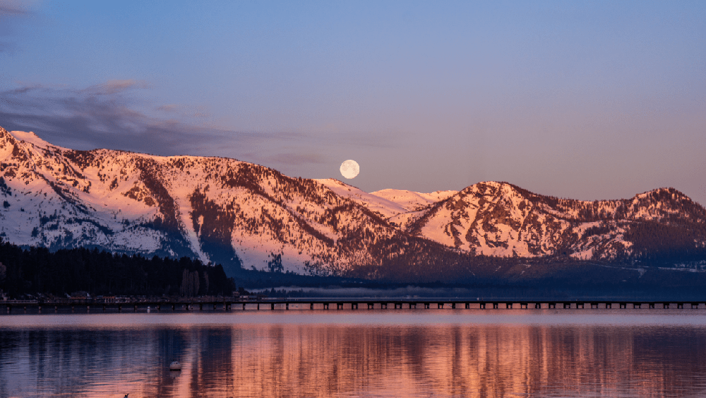 Winter moon rises over Lake Tahoe.