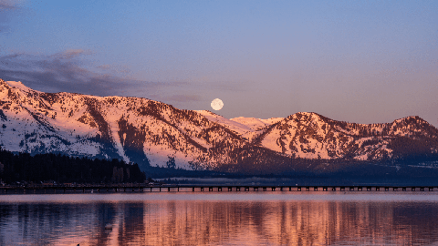 Image caption: Winter moon rises over Lake Tahoe.