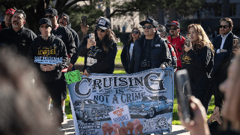 Image caption: Supporters of the lowrider community attend a press conference at the state Capitol in support of legislation that would prevent local governments from imposing cruising bans on Feb. 6, 2023.