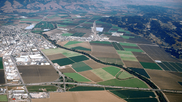 Tiny Pajaro (center) sits across the river from Watsonville in the strawberry-rich Pajaro Valley.