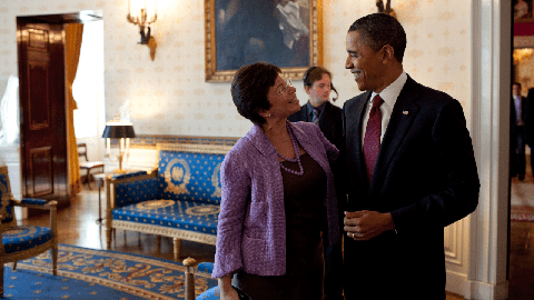 Image caption: Valerie Jarrett with the commander in chief in the Blue Room of the White House in 2010.