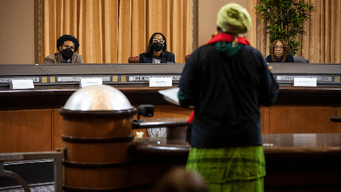 Image caption: Reparations task force members listen during the public comment portion of a December 14, 2022 meeting in Oakland.