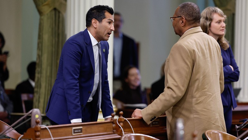 Assembly Speaker Robert Rivas chats with Assemblymember Reggie Jones-Sawyer on the first day of the new legislative session Wednesday.