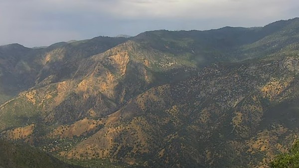 View  north over Highway 140, El Portal, and the Merced River canyon as a summer storm rolls on by. Screenshot from a time-lapse courtesy of ALERTCalifornia-UC San Diego.