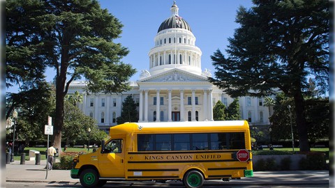 Image caption: The first all-electric school bus in the state of California pausing outside the California Capitol building in Sacramento, way back in March, 2014.