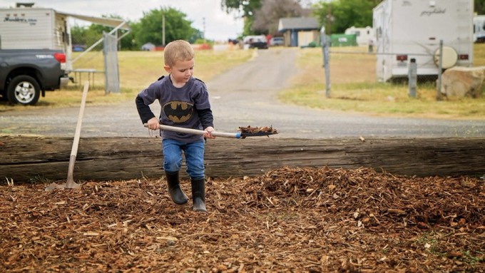 This young man with a kid-size shovel gets into the spirit of Mulch Mayhem during an earlier event.
