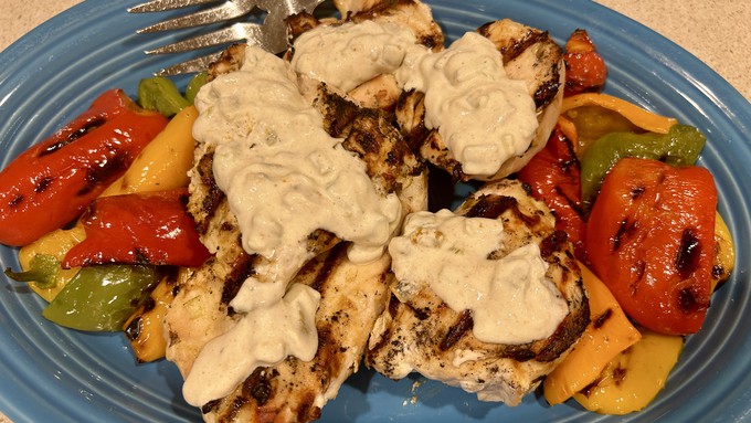 This yogurt-topped chicken and peppers dish is a great dinner for outdoor dining, or any time of year.