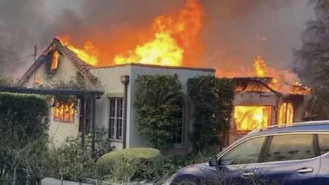 Image caption: The Altadena home of Tom Carruth and Rob Krueger burns in the Eaton fire last week.