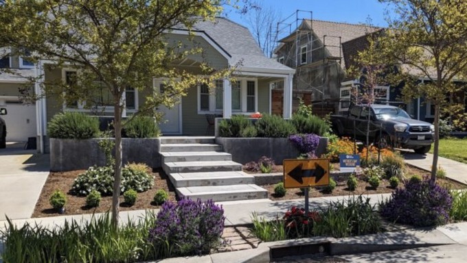 The Dal Ben family's front garden no longer has lawn, but does have many happy low-water plants.