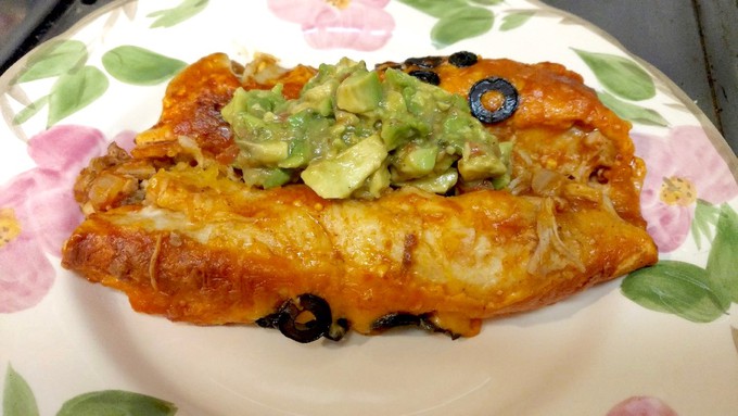 Before serving, top the enchiladas with guacamole and salsa.