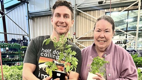 Image caption: Kevin Jordan and Debbie Arrington check out some of the plants in the vegetable section of Green Acres Nursery & Supply.