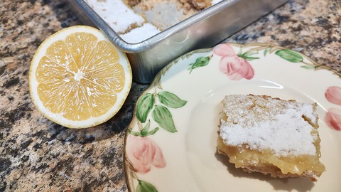 Image caption: These Meyer lemon bars gain some extra crunch from candied almonds.