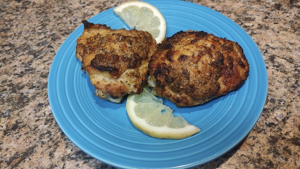 Chicken thighs achieve crispy deliciousness when marinated and baked at high heat.