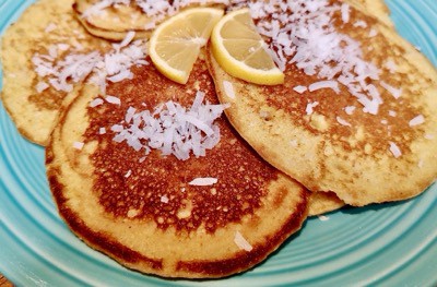 Garnish these Hawaiian-inspired pancakes with lemon and coconut.