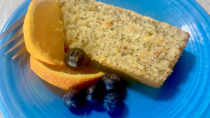 Poppy seeds and orange zest add visual interest  to this moist orange loaf cake.