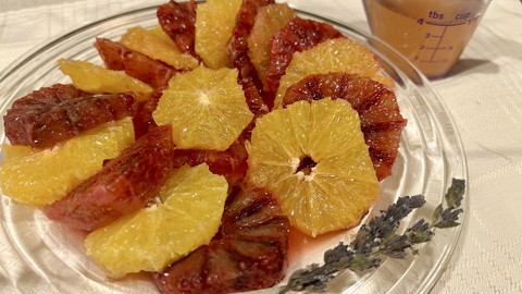 Image caption: Blood oranges deliver the eye-catching color in this plate of seasonal citrus. The lavender-lemon syrup, at upper right, is pretty, too.