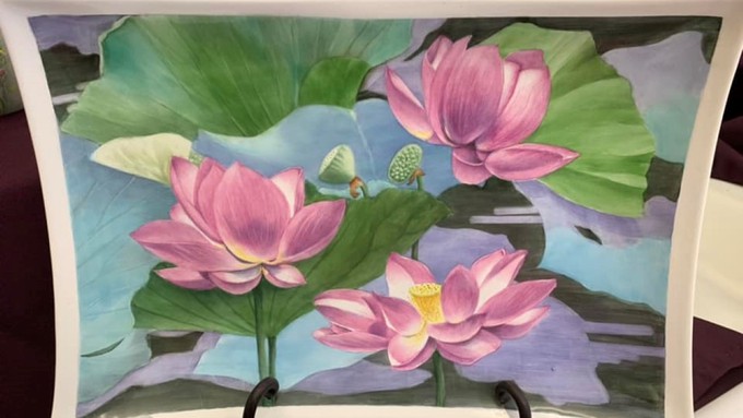 Camellia City Porcelain Artists capture the beauty of nature in such pieces as this platter covered in water lilies.