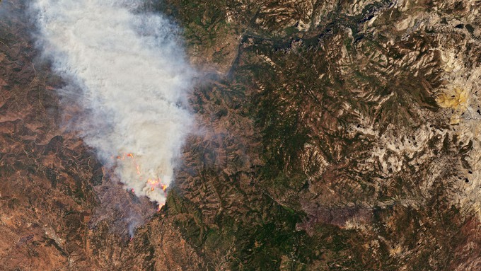 Image caption: The explosive Oak Fire in Mariposa County, as seen in a satellite image from space.