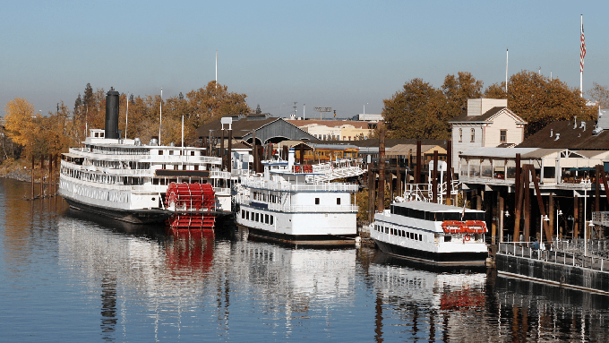 Image caption: The Delta King, a paddlewheel riverboat with hotel rooms and a live theater, docked on the Old Sacramento Waterfront