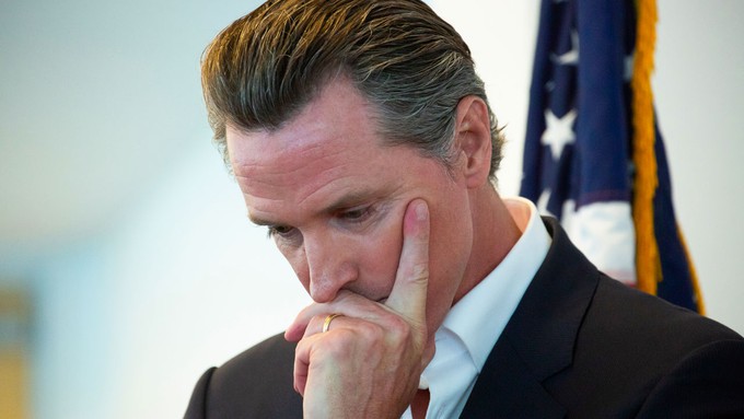 Image caption: Gov. Gavin Newsom has proposed $6 billion in cuts to programs designed to fight climate change.