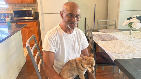 Image caption: Clifford Smith sits at a house he was leading for City Net in September 2023. Smith was previously a house leader for Sacramento Self-Help Housing, which collapsed and went bankrupt last year.