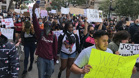 Image caption: Demonstrators in Oakland march to protest the police killing of George Floyd.