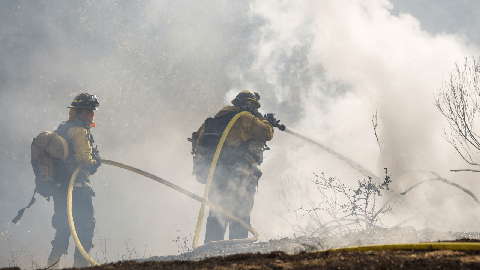 Image caption: Firefighters battle a brushfire in the Pogonip in 2020.