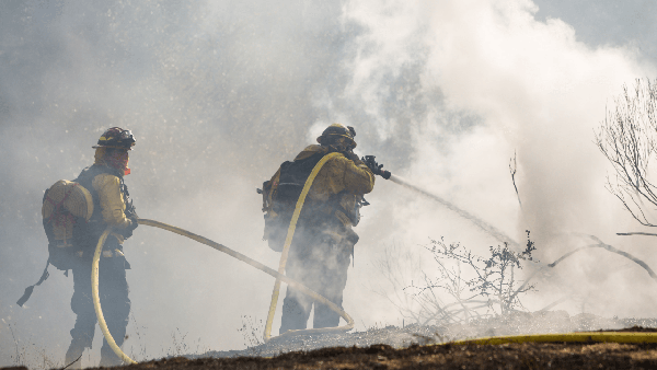 Firefighters battle a brushfire in the Pogonip in 2020.