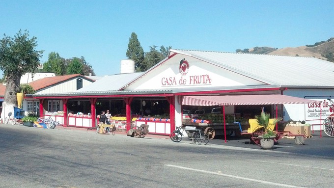 Image caption: Fresh and dried fruit, wine, nuts and more can be found at Casa De Fruta, a venerable stop for drivers traversing Pacheco Pass.