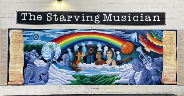 The mural on the side of The Starving Musician musical instrument shop. 