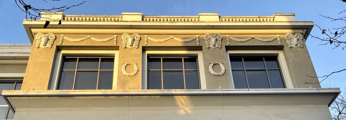 Vaguely ominous architectural detail of wreathed rams heads adorning the Rittenhouse Building, an edifice sporting  a classic, one might almost say, atavistic, vernacular.