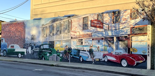 The Andy's Auto mural, depicting car culture from a bygone era and the founder of Andy's Auto Andy Mekis and his family.