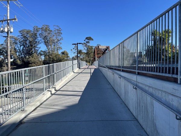 Walking up the ramp connecting the end of Pacific Street with the span over the San Lorenzo River.