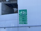 A sign at the end of Pacific Street by the boardwalk, at the base of the ramp up to the span over the San Lorenzo River.  
The sign indicates distance at the point in the rail trail to various destinations.