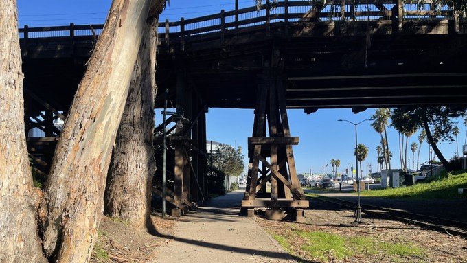 Looking east as the path passes under the old West Cliff trestle.