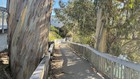 Looking down the old pedestrian/bike path which climbs up from the bridge to the narrow sidewalk on East Cliff Drive.  Most bike riders dismount and walk on this stretch because it's so narrow.
At the top of the path where it meets East Cliff Drive, there is no bike path for several hundred feet and the sidewalk is narrow, so this section is currently a pain point for bicycle commuters.