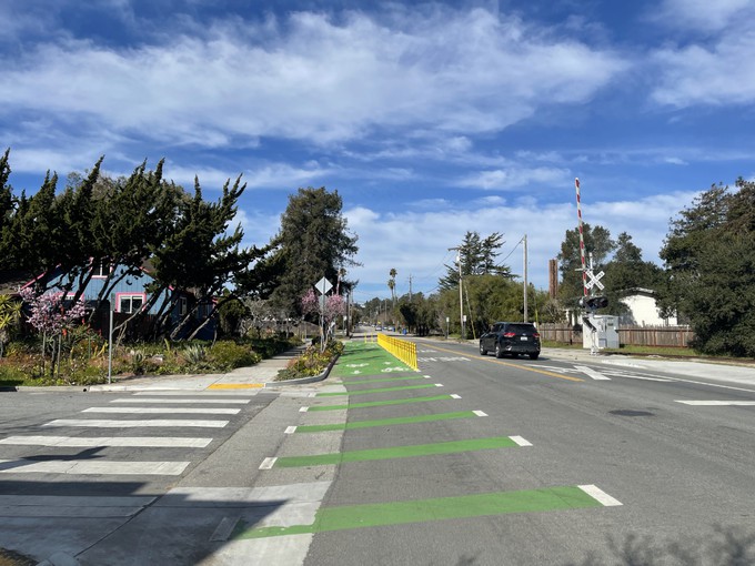 Having crossed Bay Street, looking north at the bicycle green lane meeting up with the rail trail.