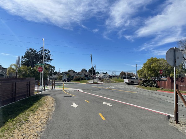 Looking east toward the intersection of the rail trail with Rankin Street and Seaside Street.