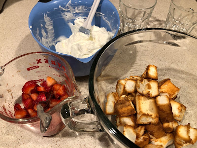 Three bowls of berries, whipped cream and toasted cake chunks