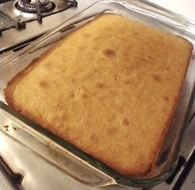 Cake in glass pan on stovetop