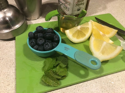 Blueberries, lemon slices and mint sprigs ready