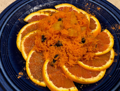 Orange-carrot salad on a blue plate