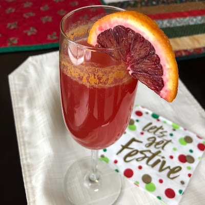 Pink cocktail with orange slice