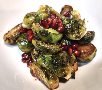 Brussels sprouts and pomegranate seeds on a plate