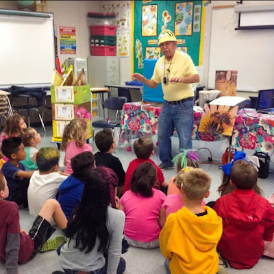 Man talking to group of children